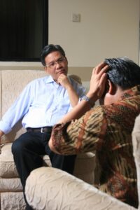 One man seeking counseling from a male professional because he suffers from caregiver burnout.