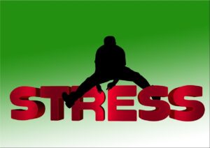 An image of a person in silhouette Stradling big red letters spelling STRESS - re overcoming PTSD. Image by Gerd Altmann
